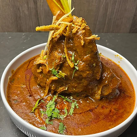 Awadhi lamb shank in rich gravy