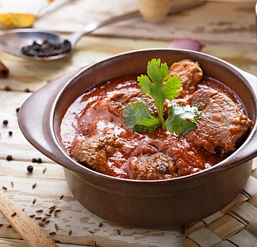 Traditional mutton curry with cilantro